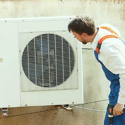 Technician installing AC